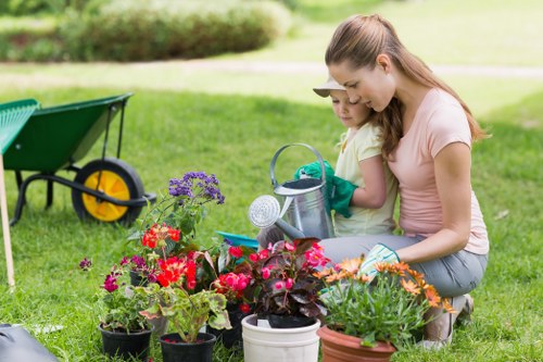 Horticulturists working on a lush Earls Court garden